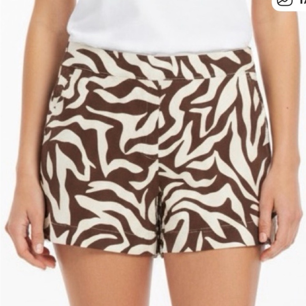 SPANX On-the-Go Printed Shorts in a zebra pattern. Brown and white L pull on